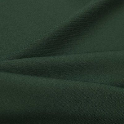 Ткань костюмная 21010 2076, 225 гр/м2, шир.150см, цвет т.зеленый - купить в Магадане. Цена 390.73 руб.